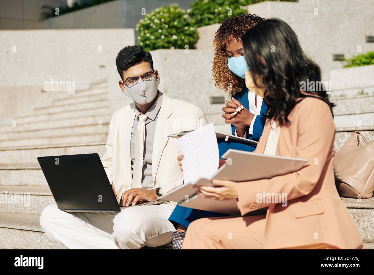 Entrepreneurs having meeting outdoors Stock Photo