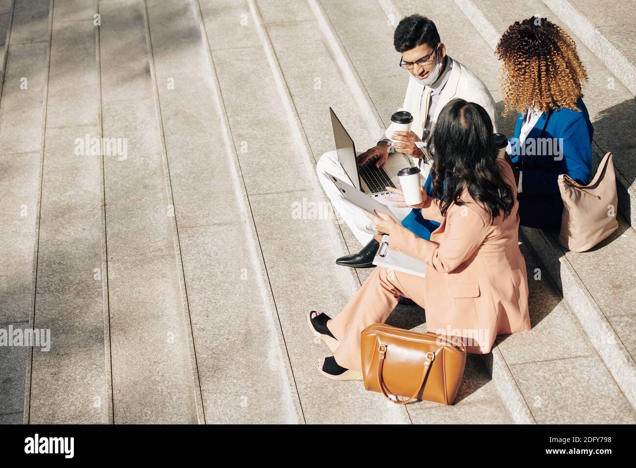 Entrepreneurs having outdoor meeting Stock Photo