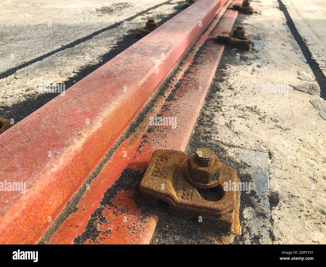 Gantry crane rail fastened to concrete foundation with anchor bolts