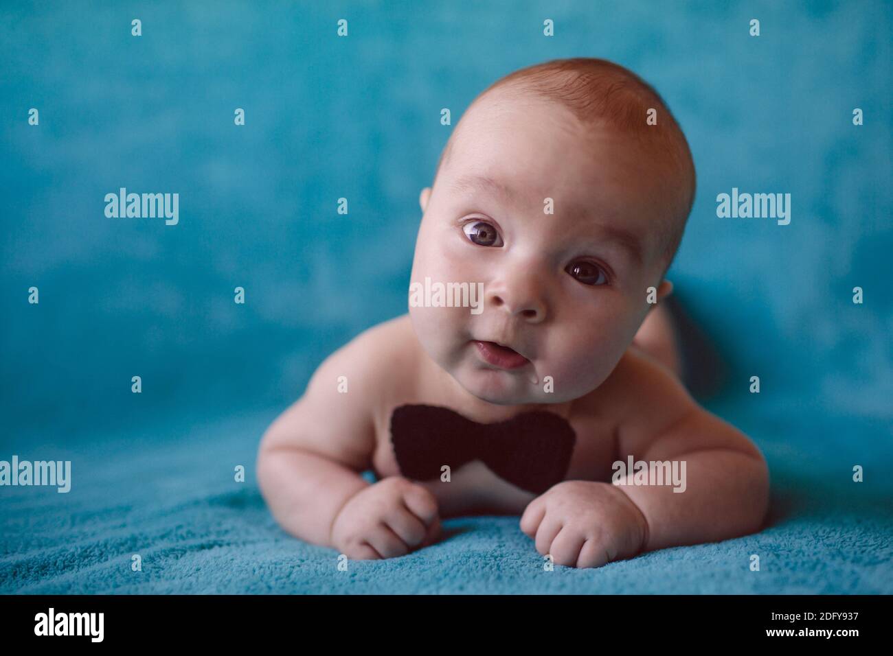 Cute 3 month baby boy on a blue blanket Stock Photo