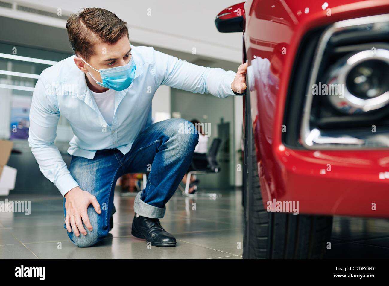 Man checking new car tires Stock Photo