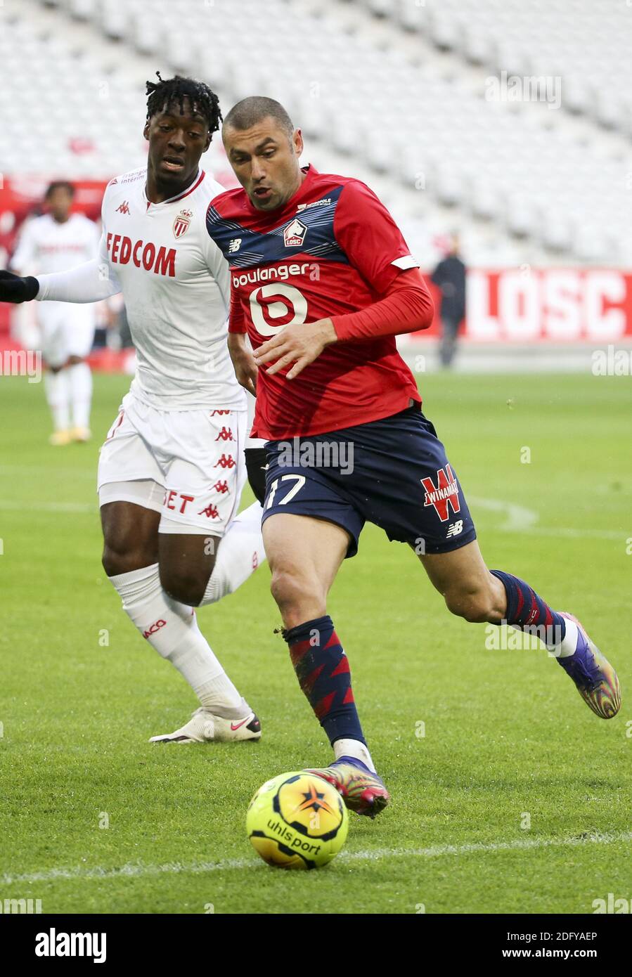 Burak Yilmaz of Lille, Axel Disasi of Monaco (left) during the French championship Ligue 1 football match between Lille OSC and  / LM Stock Photo