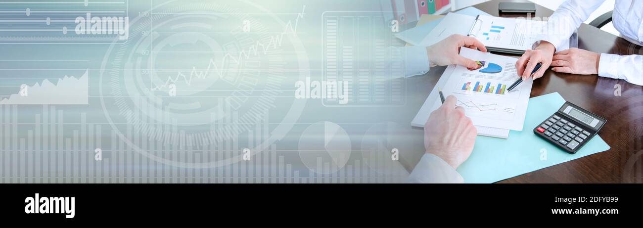 Two business people analyzing charts; panoramic banner Stock Photo - Alamy