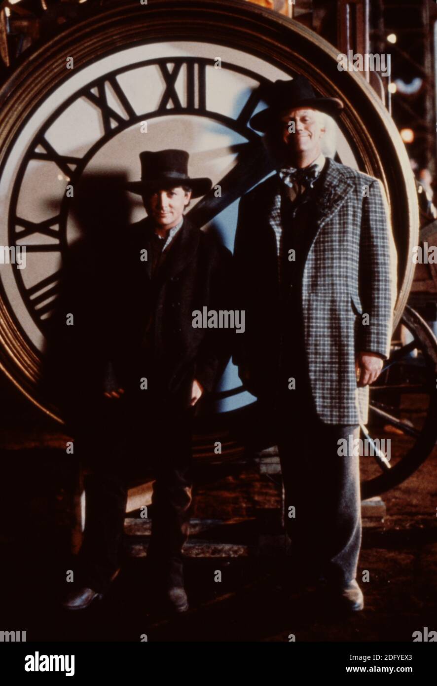 Marty McFly and Emmett Brown characters in front of the clocktower Stock Photo