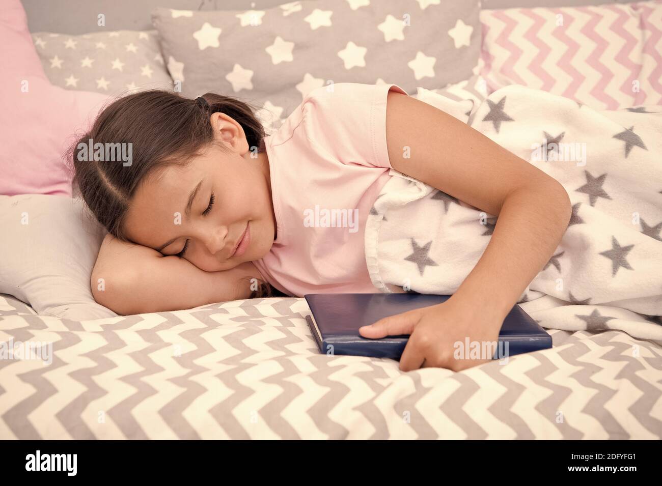 More you read, better you sleep. Little child sleep in bed. Sleepy time