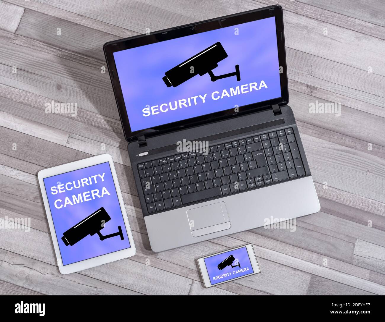 Security camera concept shown on different information technology devices Stock Photo