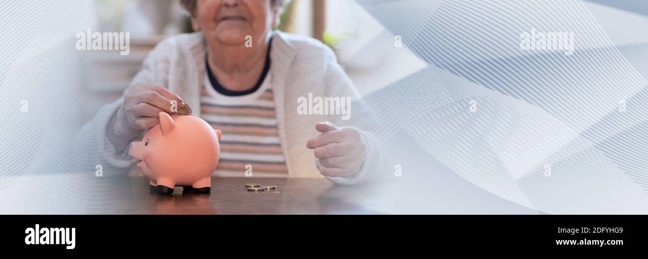 Elderly woman putting a coin in a piggy bank; panoramic banner Stock ...