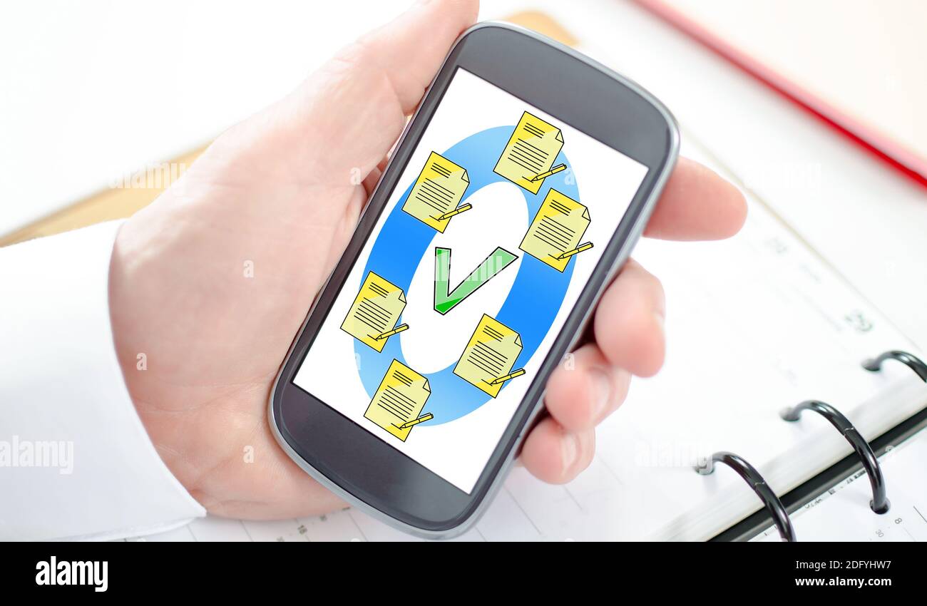 Document validation concept shown on a smartphone screen Stock Photo