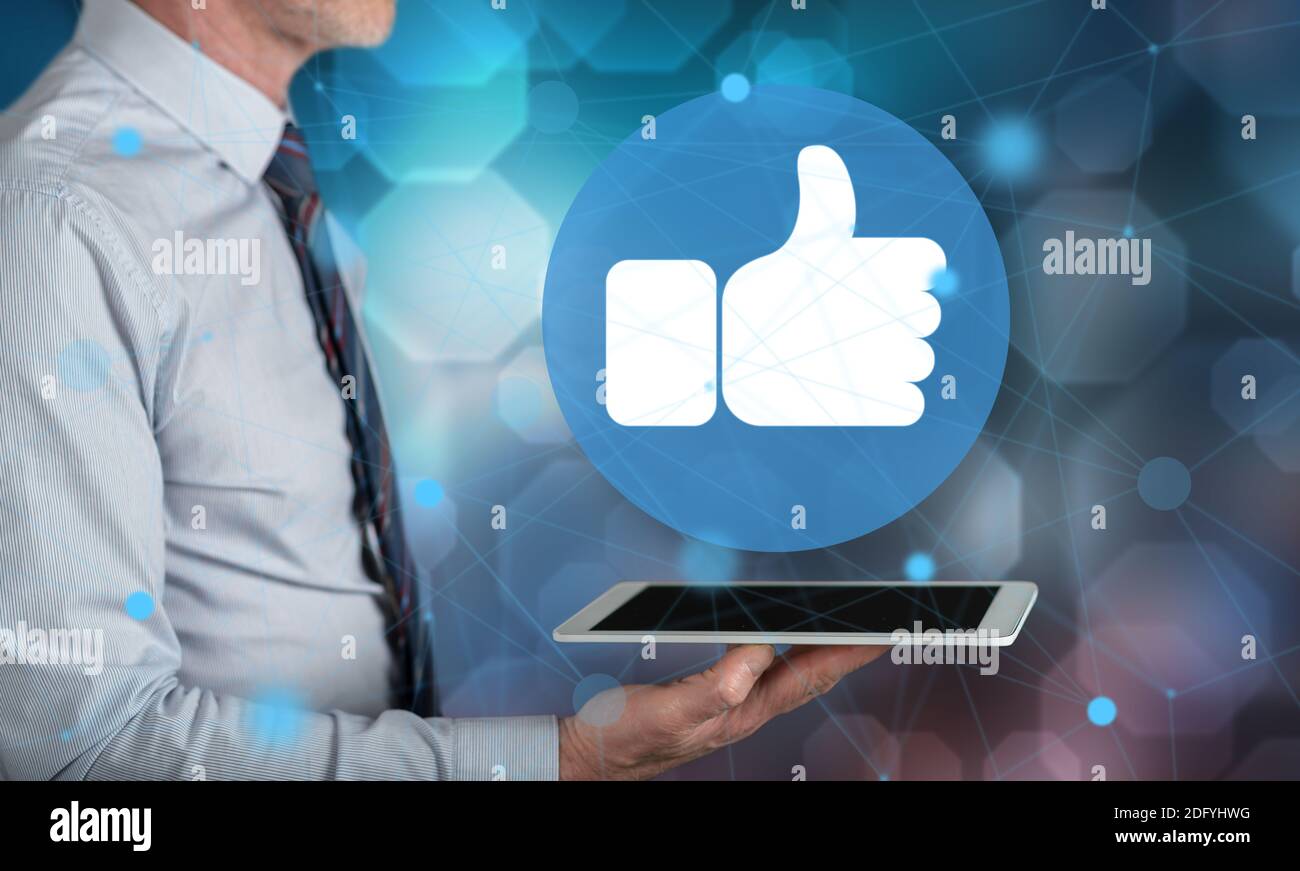 Rating concept above a tablet held by a man Stock Photo