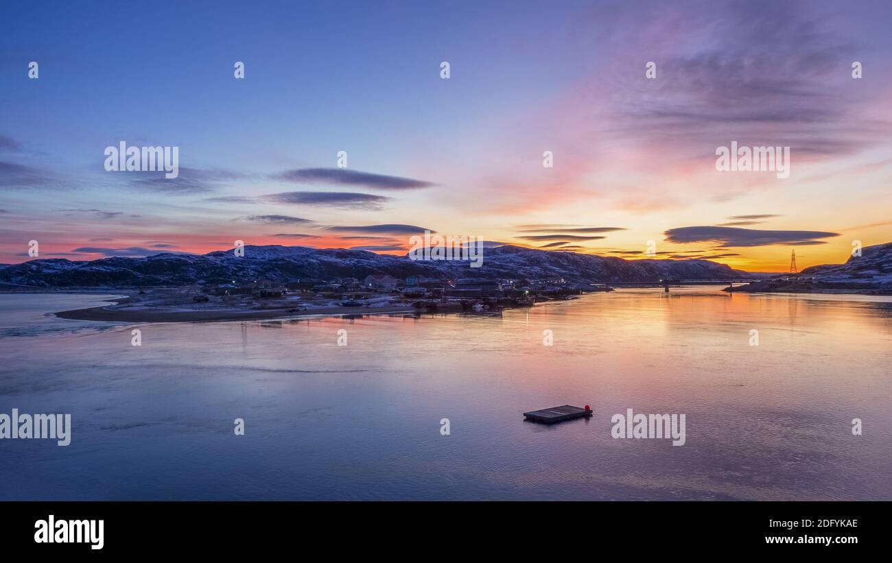 Morning sunrise panoramic view of winter Teriberka. Russia. Stock Photo