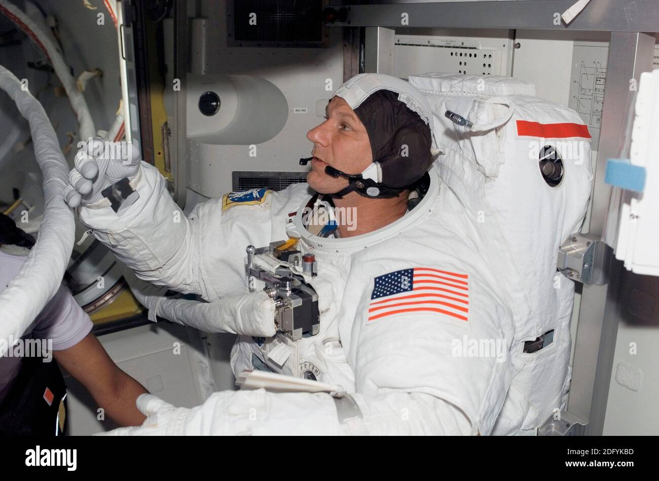 ISS - 08 July 2006 - Astronaut Piers J Sellers, STS-121 mission specialist, attired in his Extravehicular Mobility Unit (EMU) spacesuit, prepares for Stock Photo