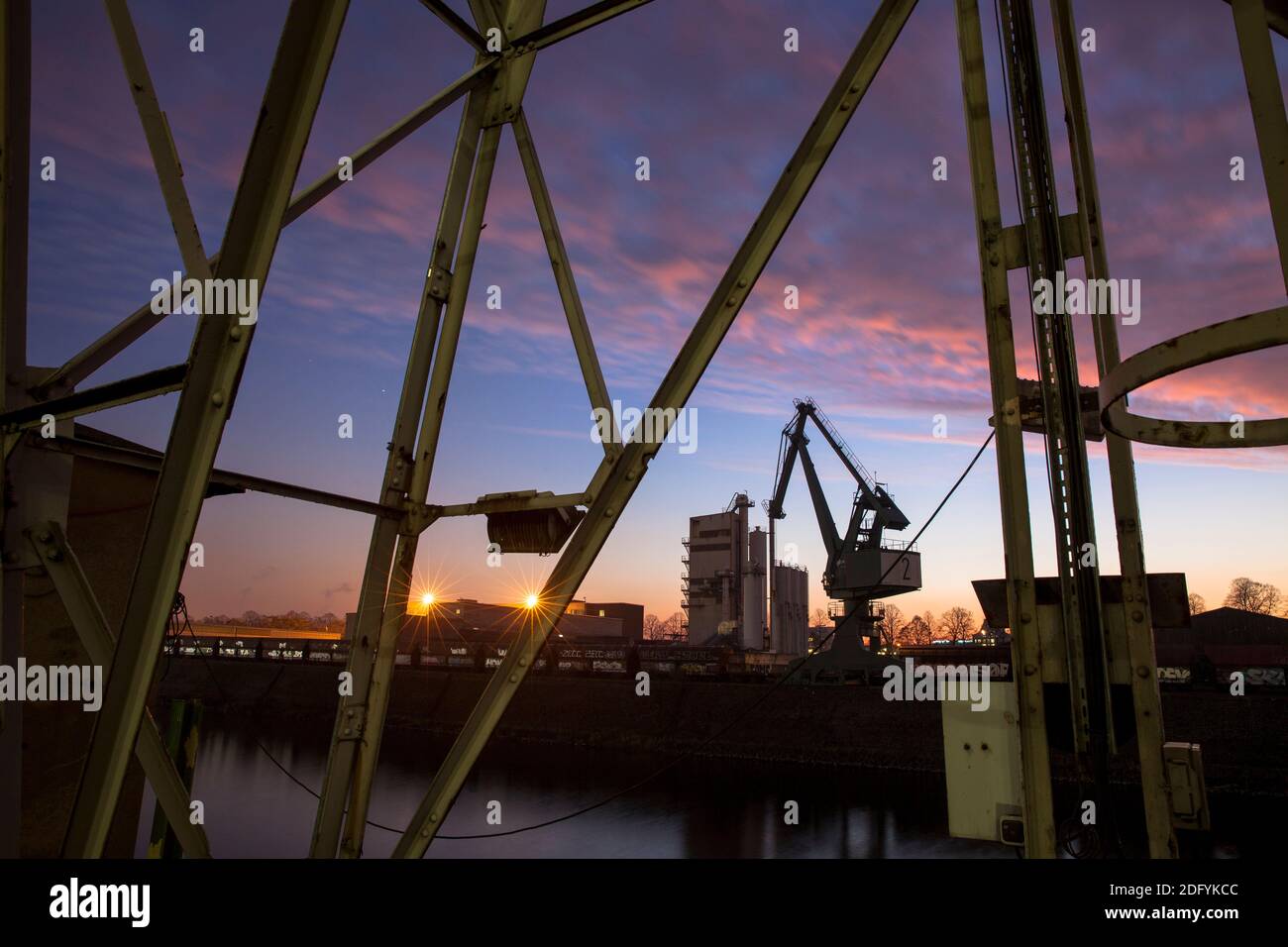loading cranes in the Rhine harbor in the district Deutz, Cologne, Germany. Stock Photo