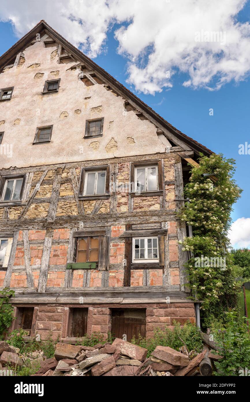 Facade of an old abandoned half-timbered house Stock Photo