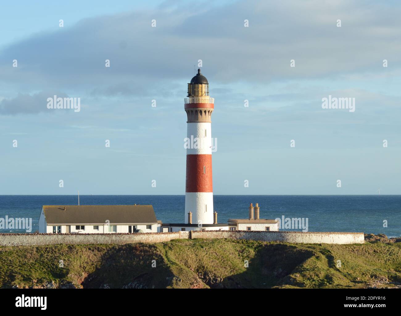 The Buchan Ness lighthouse at Boddam, Aberdeenshire, Scotland. once a vital navigational aid for the North Sea, now a guesthouse. Stock Photo