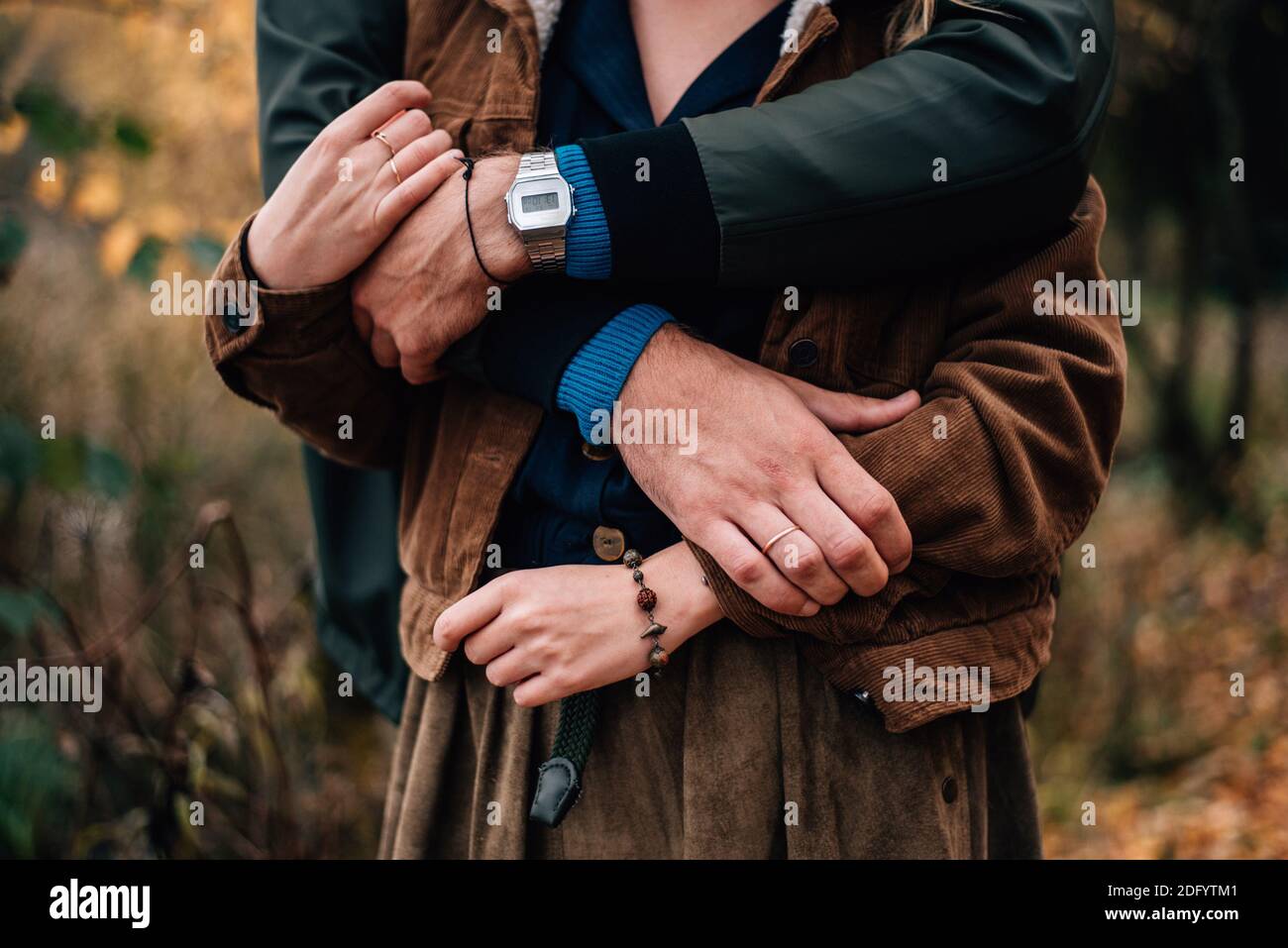 girl and boy hug each other in autumn Stock Photo