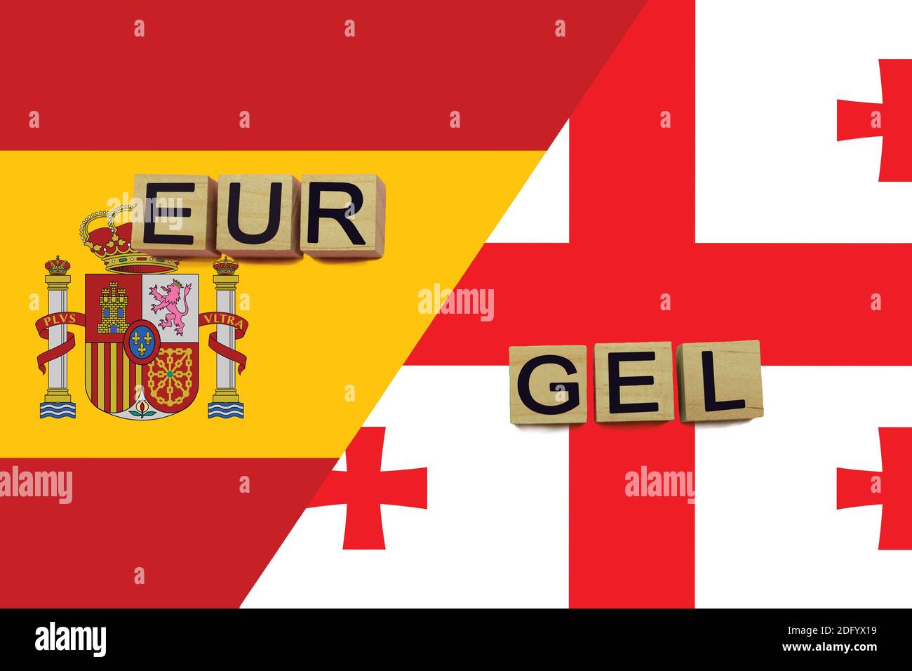 Spain and Georgia currencies codes on national flags background. International money transfer concept Stock Photo