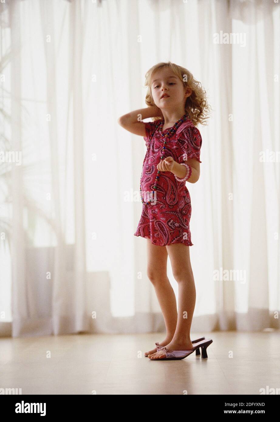 Girl with too big shoes Stock Photo Alamy