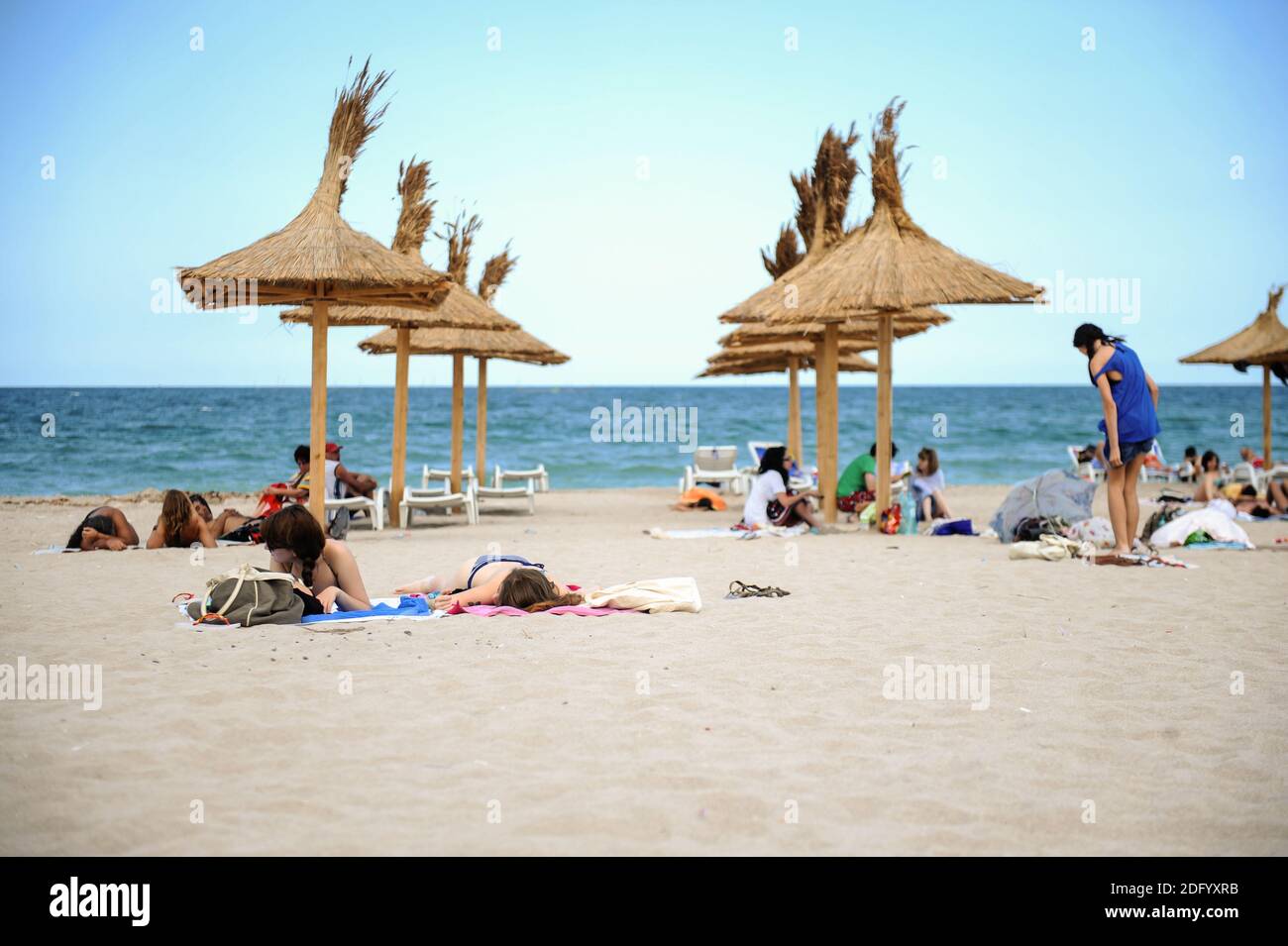 Vama Veche, Romania - June 29, 2012: People enjoy the sun and sand on a beach from the Black Sea resort of Vama Veche. Stock Photo