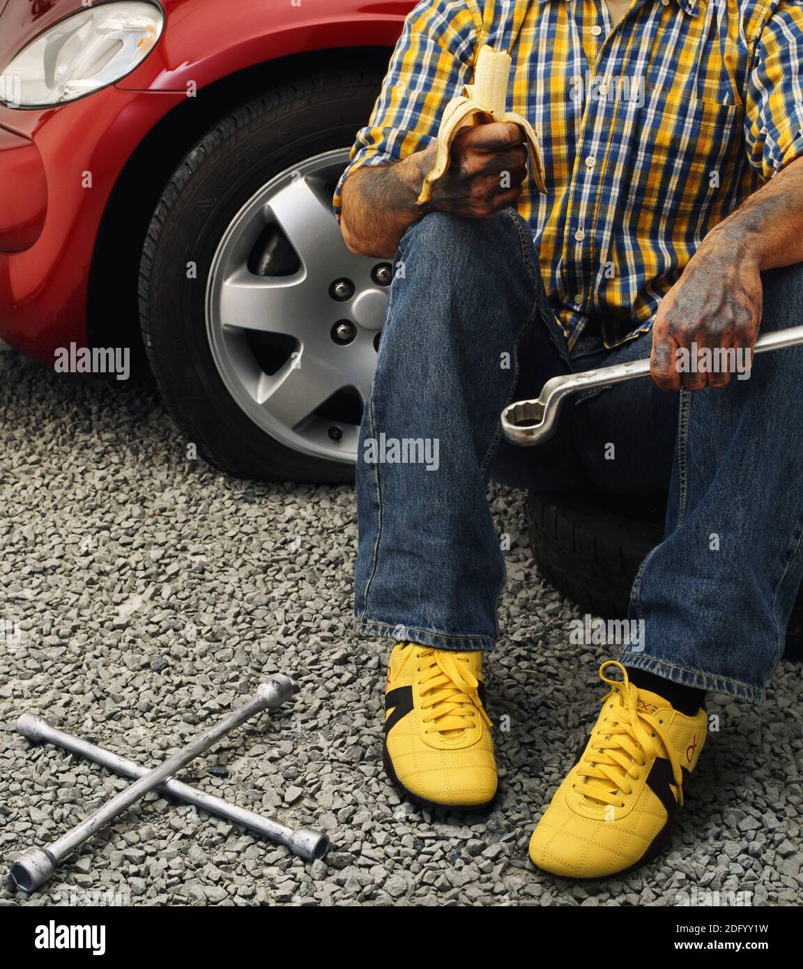 Man changing the wheel Stock Photo