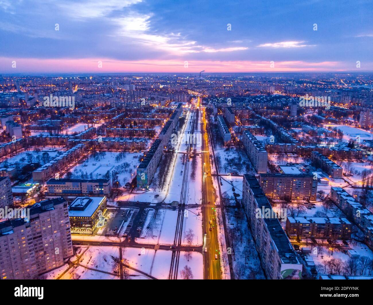 Aerial city winter view with crossroads and roads, houses, buildings, parks. Helicopter drone shot. Wide Panoramic image. Kharkiv, Ukraine Stock Photo