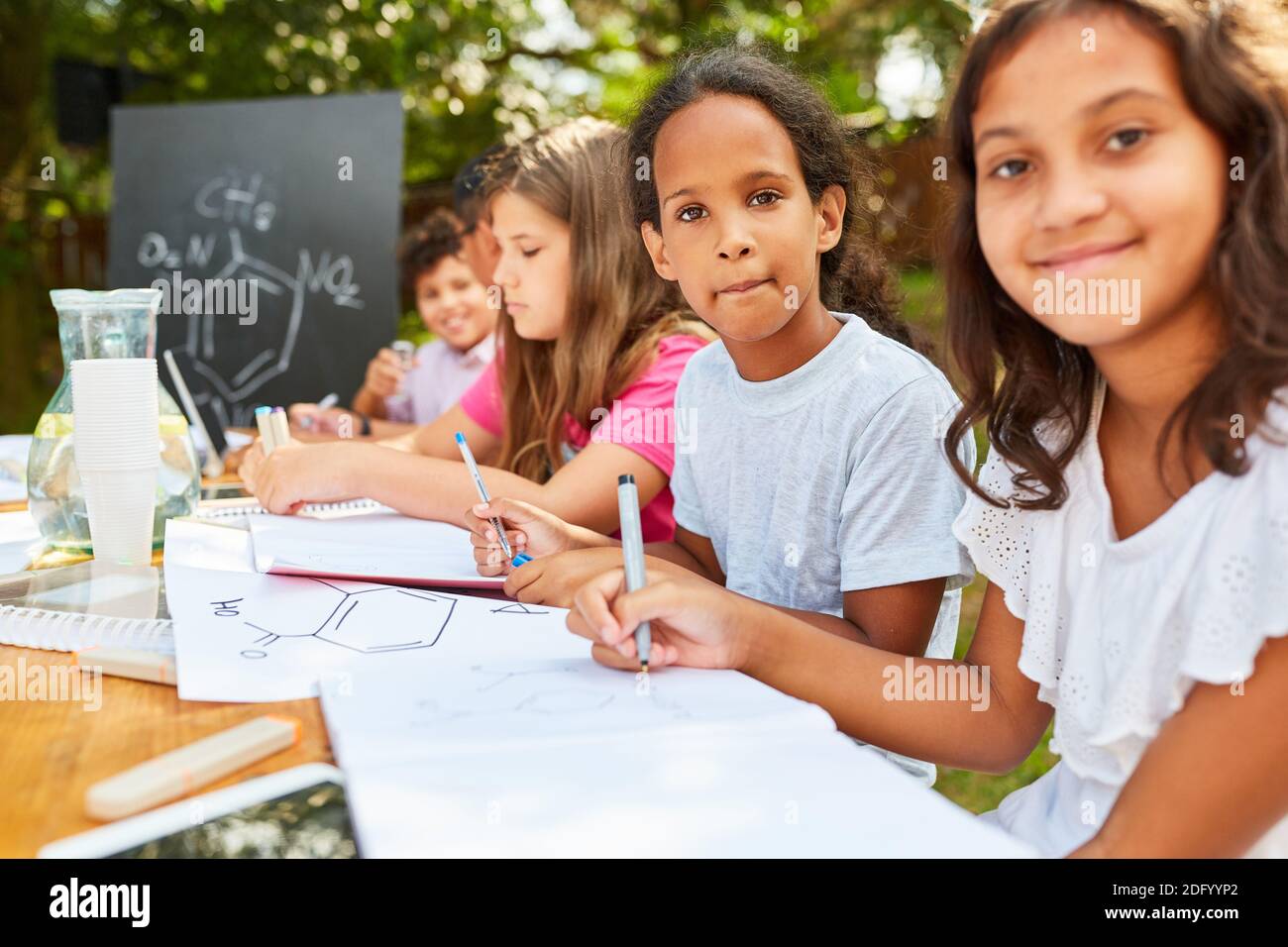 Group of kids at chemistry tutoring class on summer vacation course Stock Photo