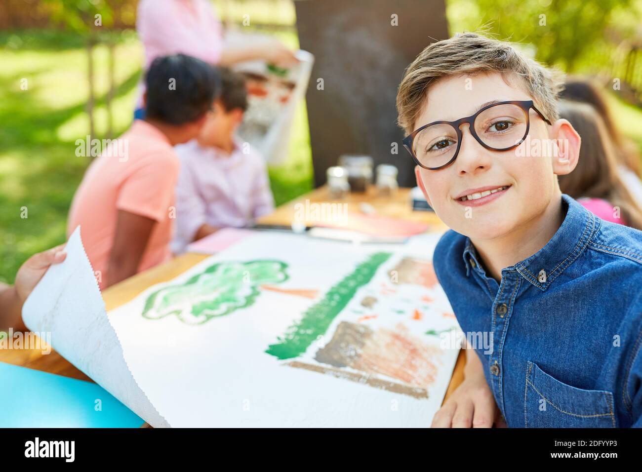 Boy as a student in biology class at summer vacation camp Stock Photo
