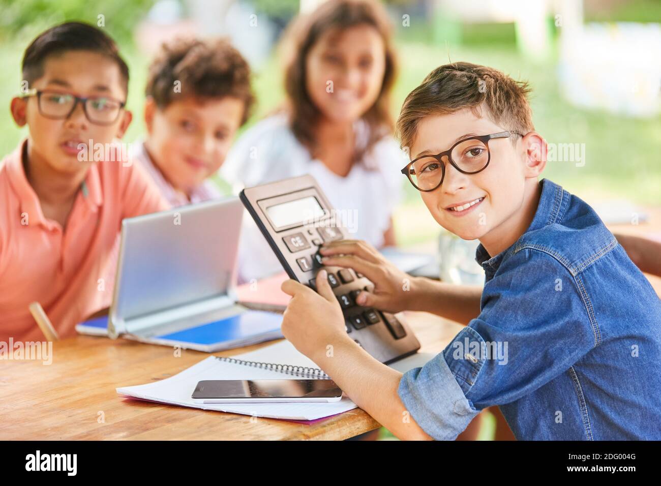 Group of children in tutoring lessons for math in summer school vacation course Stock Photo