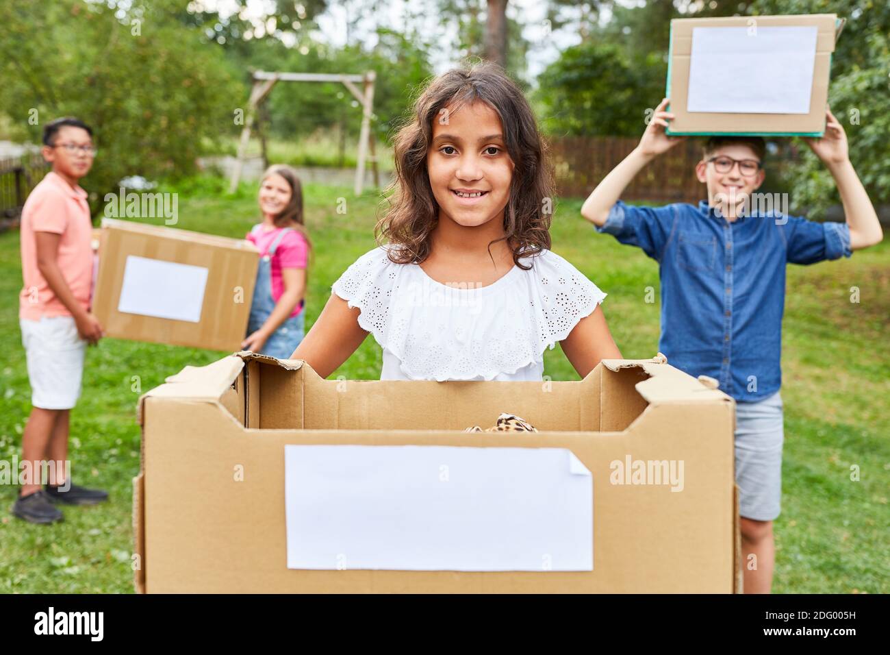 Children collect donations in kind and old clothes as volunteers in aid ...