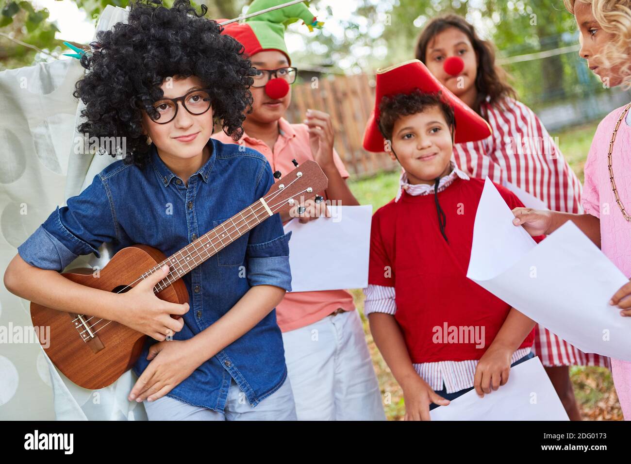 Children in funny costumes at the talent show at the holiday camp or at the  carnival Stock Photo - Alamy