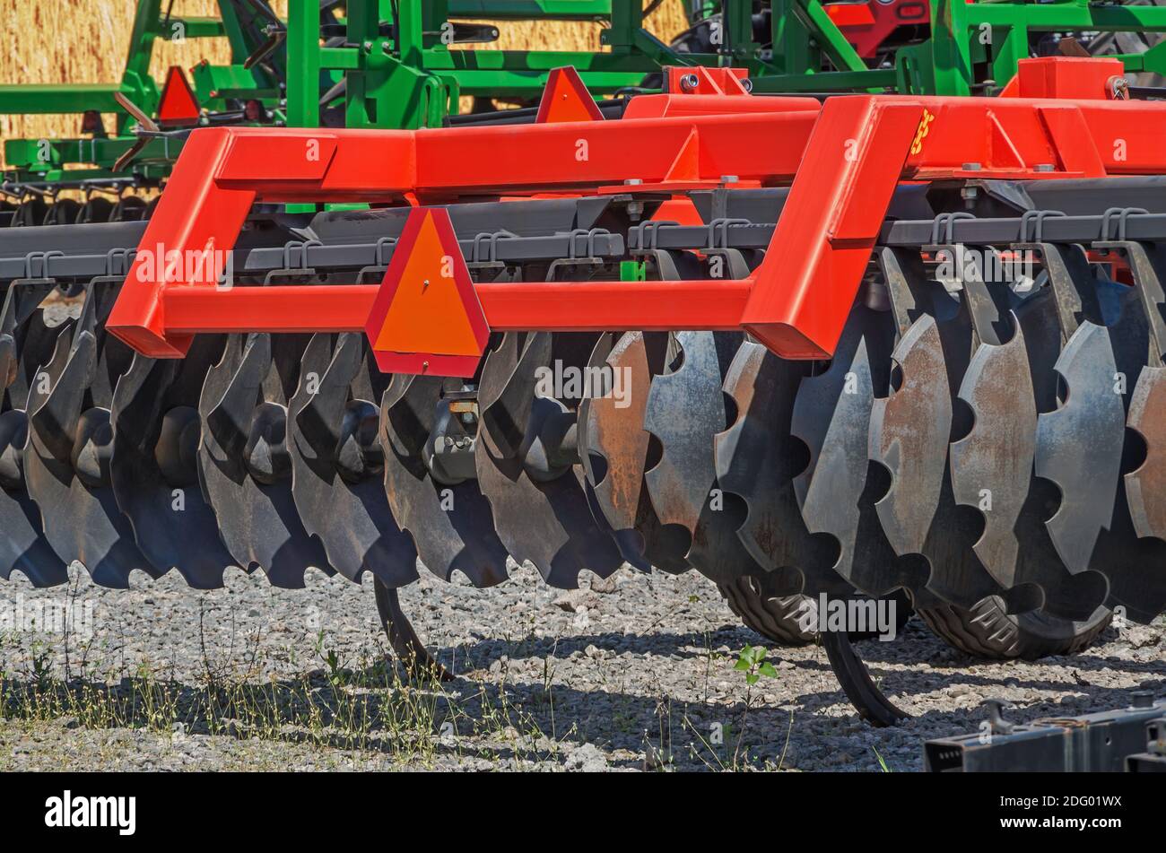 Disc harrow prepared for future seasonal work and installed for winter storage at tractor