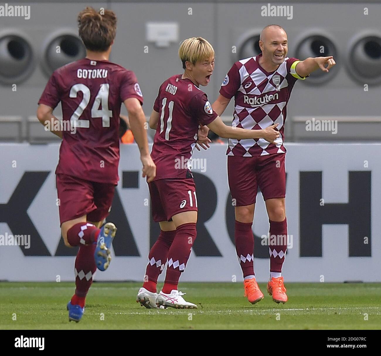 Doha, Qatar. 7th Dec, 2020. Andres Iniesta (R) of Vissel Kobe celebrates his goal during the round of 16 match of the AFC Champions League between Shanghai SIPG FC of China and Vissel Kobe of Japan in Doha, Qatar, Dec. 7, 2020. Credit: Nikku/Xinhua/Alamy Live News Stock Photo