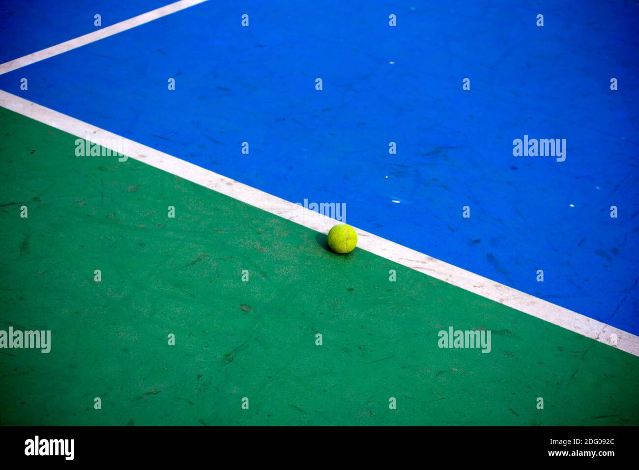 Tennis balls on the tennis court. Tennis ball out of tennis court
