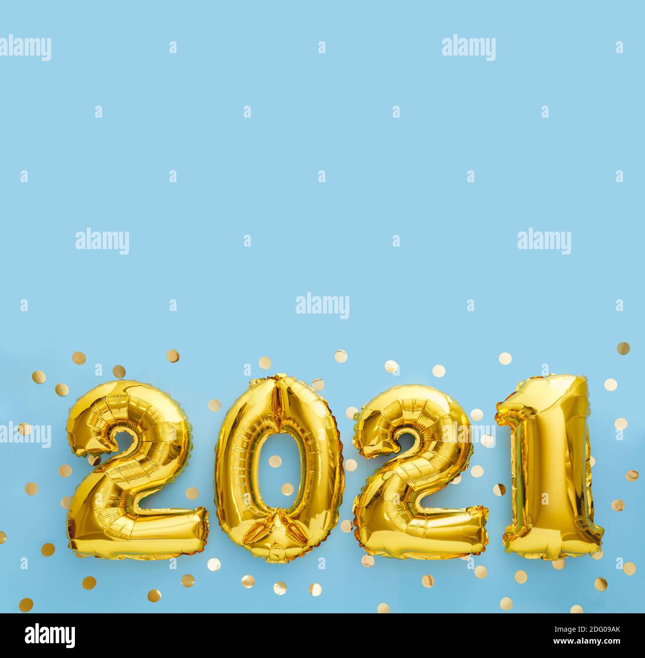 2021 gold foil balloons on blue background with confetti. New Year eve invitation 2021. Square flat lay with copy space Stock Photo