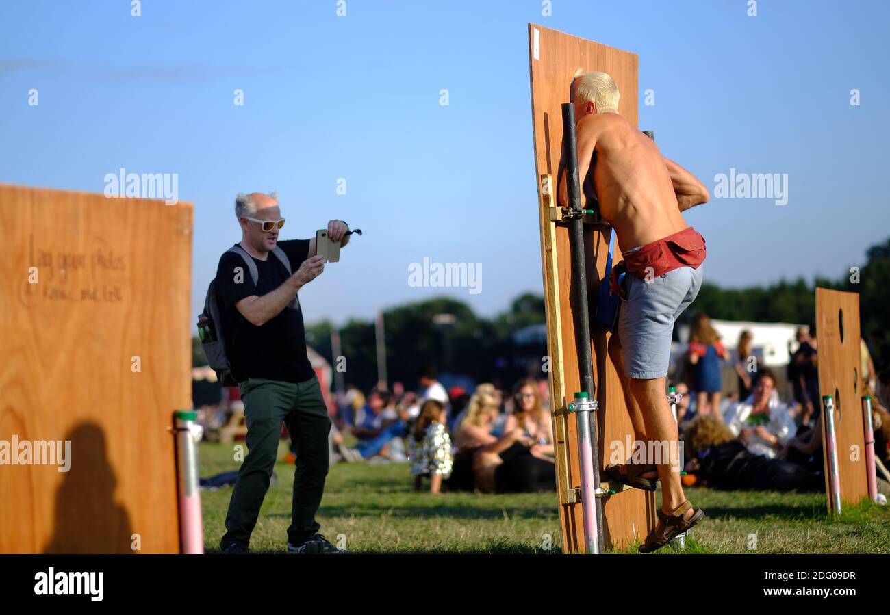 Two adult men playing around at a festival Stock Photo