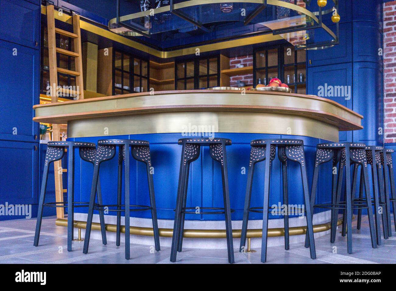 Modern kitchen, with club chairs and bar, blue combination Stock Photo ...