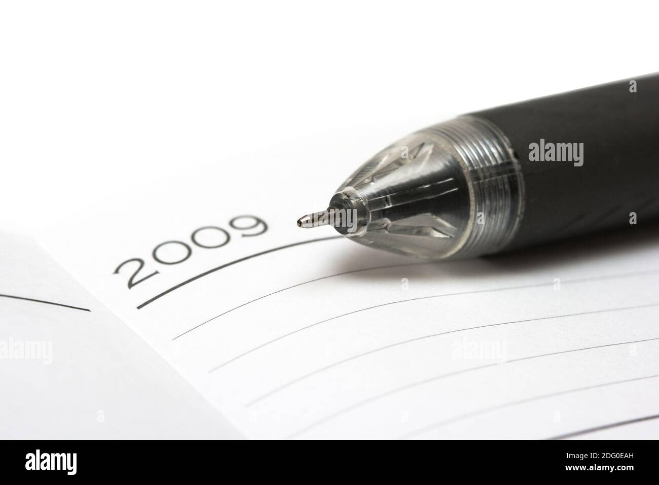 Black pen with opened notebook Stock Photo