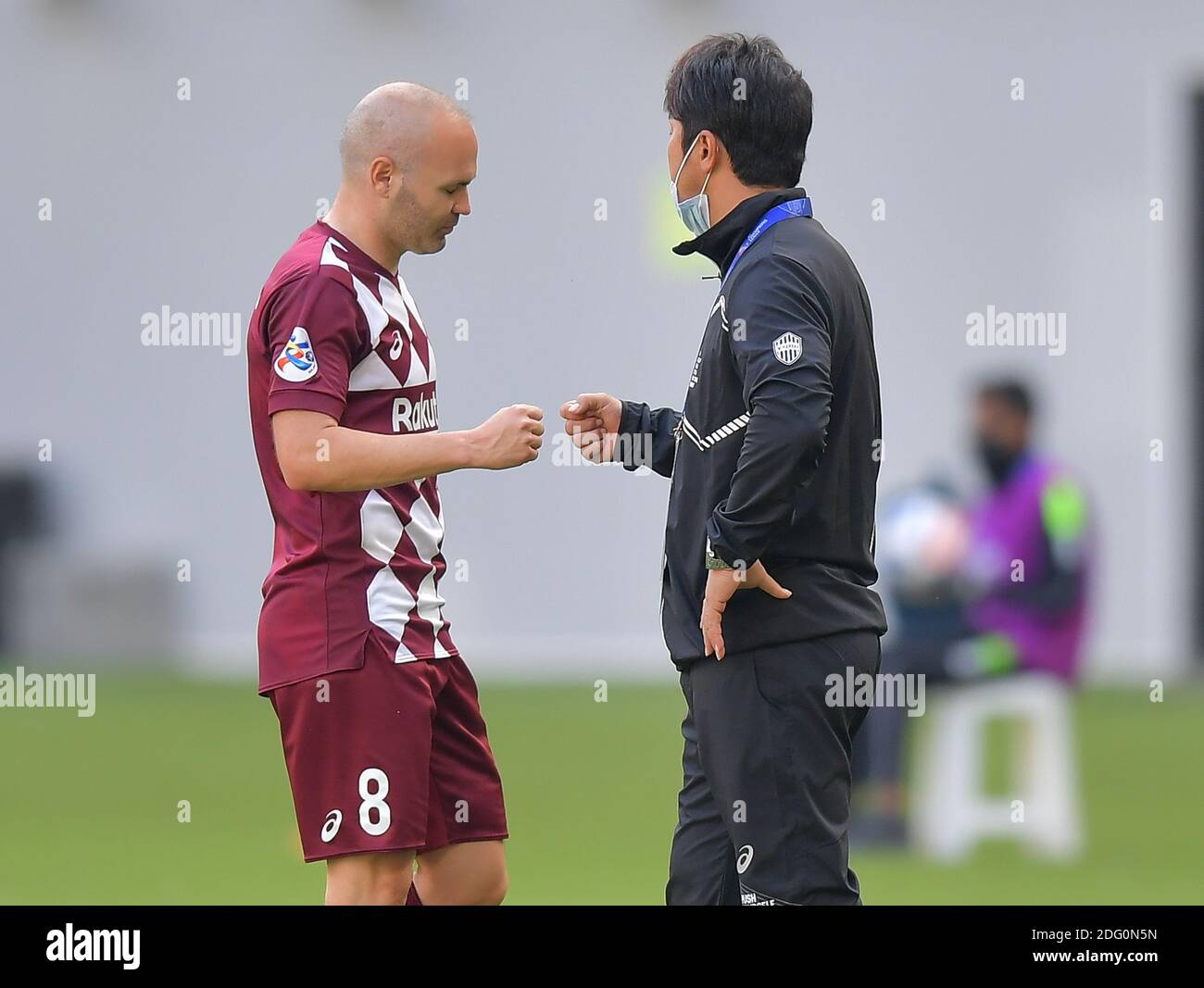 Doha, Qatar. 7th Dec, 2020. Andres Iniesta reacts with head coach Atsuhiro Miura of Vissel Kobe during the round of 16 match of the AFC Champions League between Shanghai SIPG FC of China and Vissel Kobe of Japan in Doha, Qatar, Dec. 7, 2020. Credit: Nikku/Xinhua/Alamy Live News Stock Photo