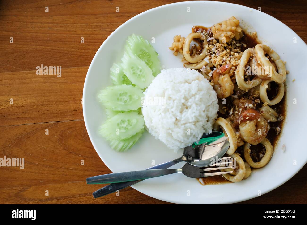 shrimp squid stir fried with garlic serving with rice Stock Photo - Alamy