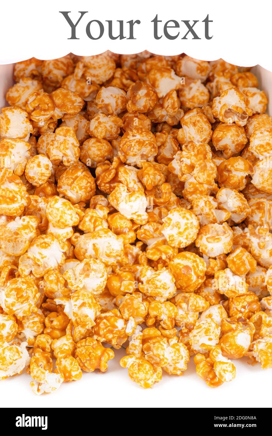Sweet caramel candy popcorn rolling from a basket white background