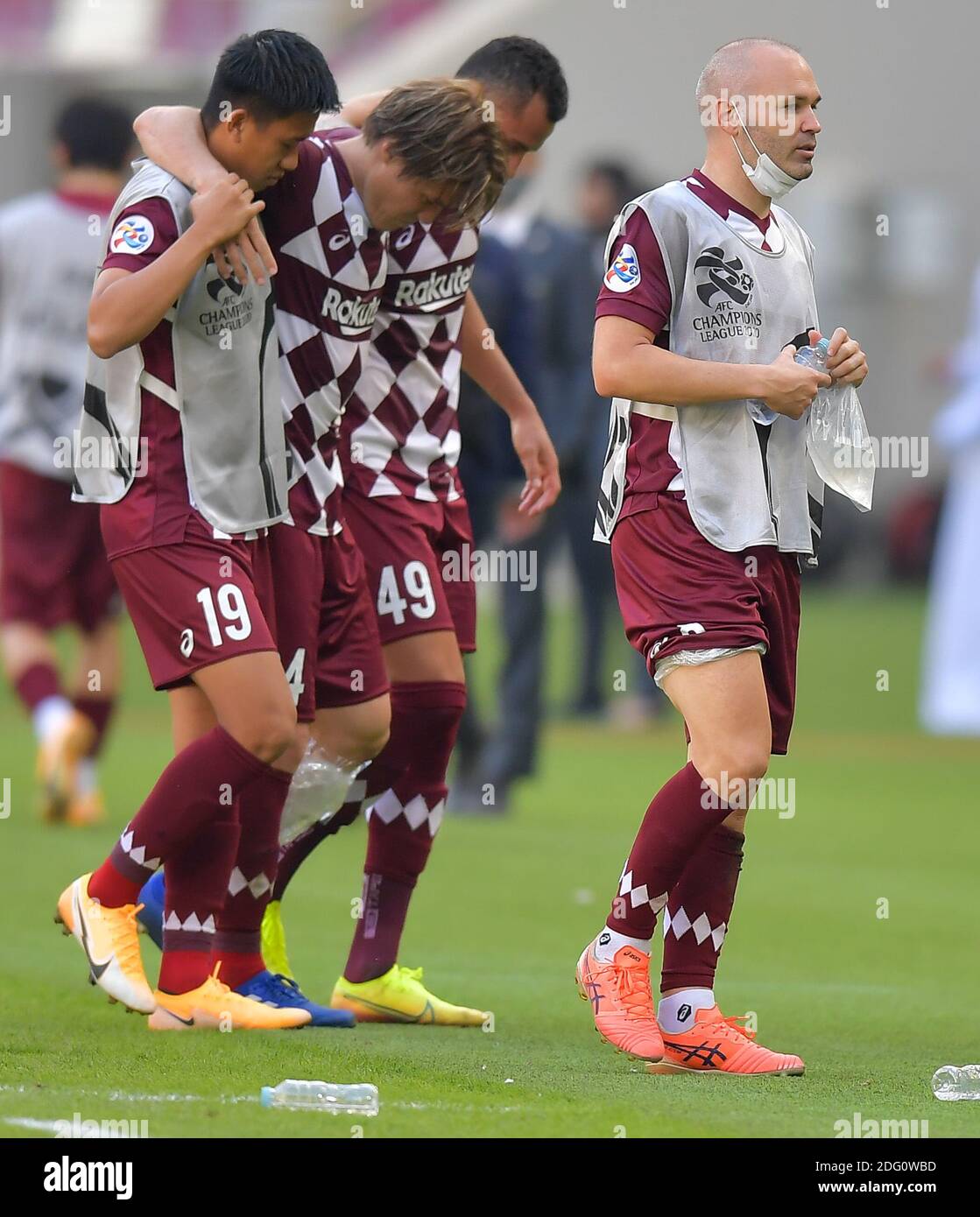 Doha, Qatar. 7th Dec, 2020. Andres Iniesta (R) of Vissel Kobe reacts after the round 16 match of the AFC Champions League between Shanghai SIPG FC of China and Vissel Kobe of Japan in Doha, Qatar, Dec. 7, 2020. Credit: Nikku/Xinhua/Alamy Live News Stock Photo