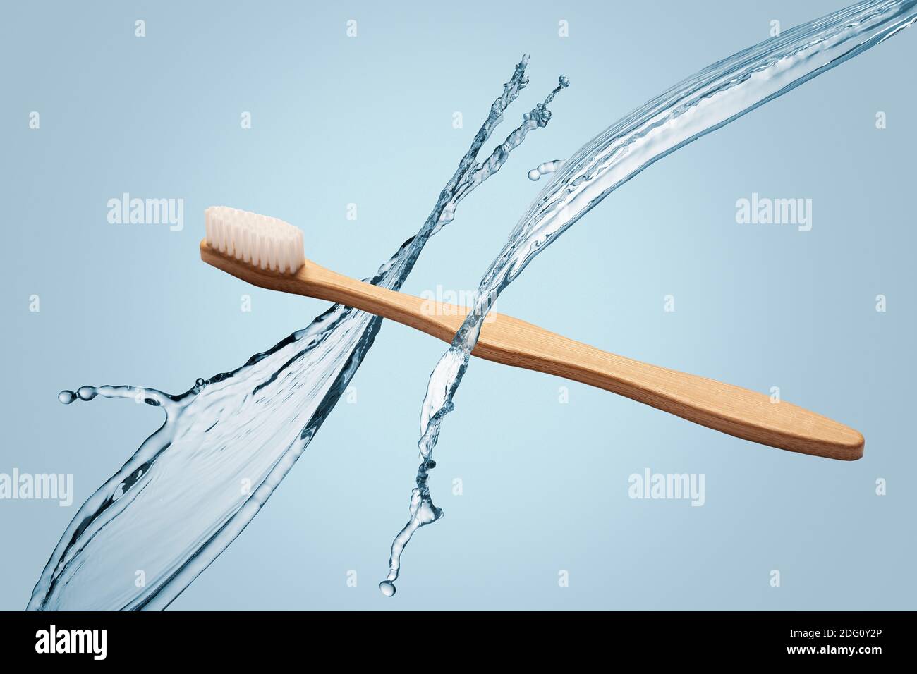Single natural wooden bamboo toothbrush floating on a blue background ...