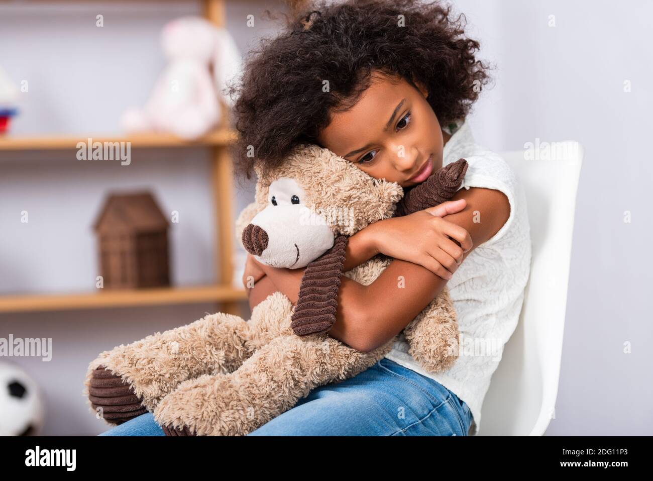 Girl hugging teddy bear hotsell