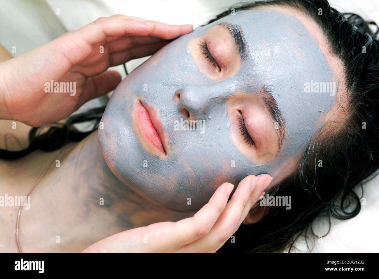 Mud mask on face Stock Photo Alamy
