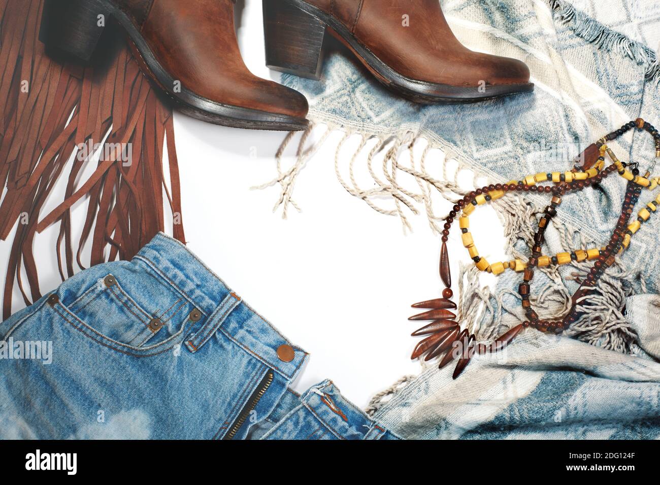 Boho Style. Leather Boots Wooden Necklace Denim Shorts and Hippie Bag with Fringe on White Background. Overhead View of Woman s Casual Day Outfits Stock Photo Alamy