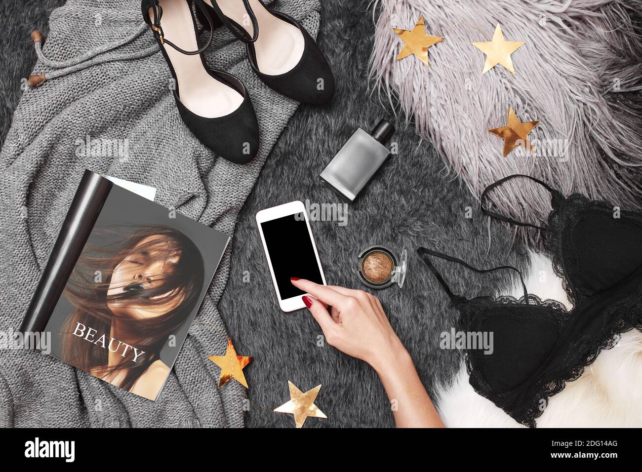 Female Hands using Mobile on Fashion Background. Woman Customer Shopper