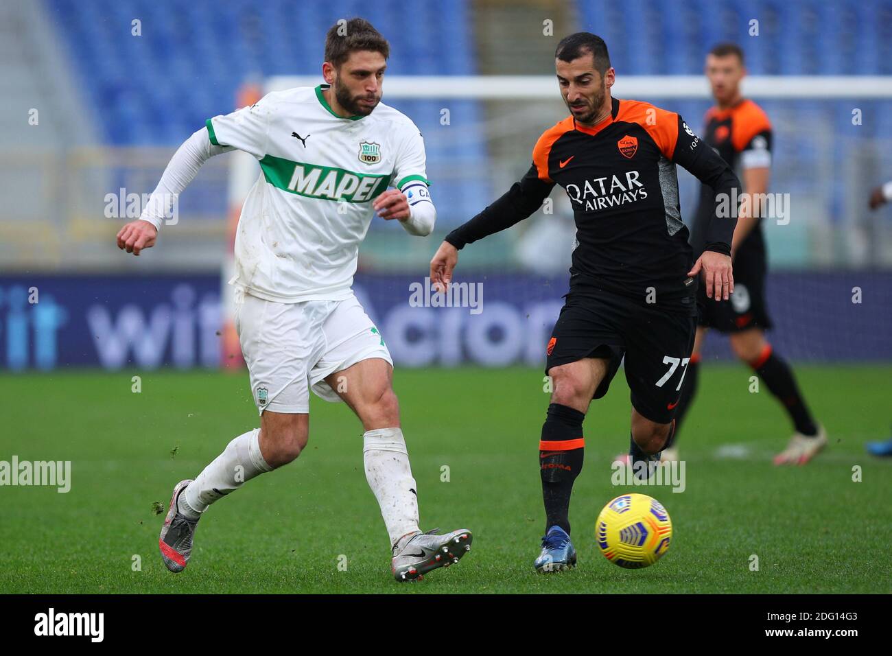 Domenico Berardi of Sassuolo (L) vies for the ball with Henrikh Mkhitaryan  of Roma (R) during the Italian championship Serie A football match between  AS Roma and US Sassuolo Calcio on December