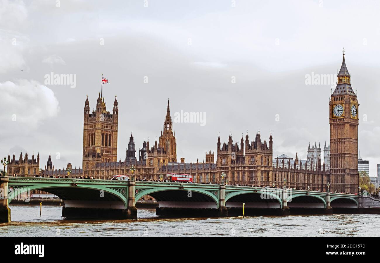 London, the Big Ben tower of the famous Palace of Westminster with urban traffic and tourists Stock Photo
