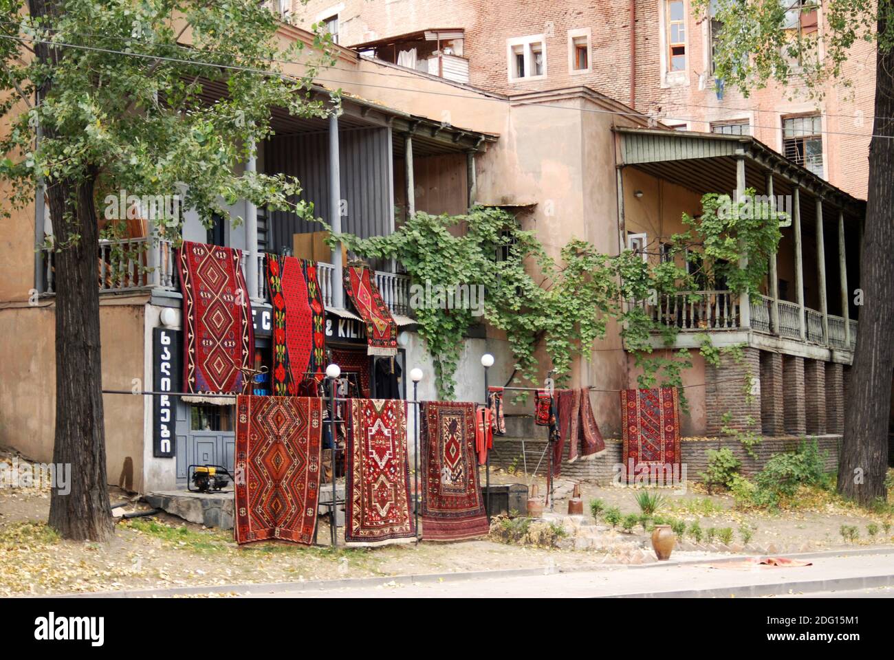house with balconies and carpets for sale. Tbilisi Stock Photo