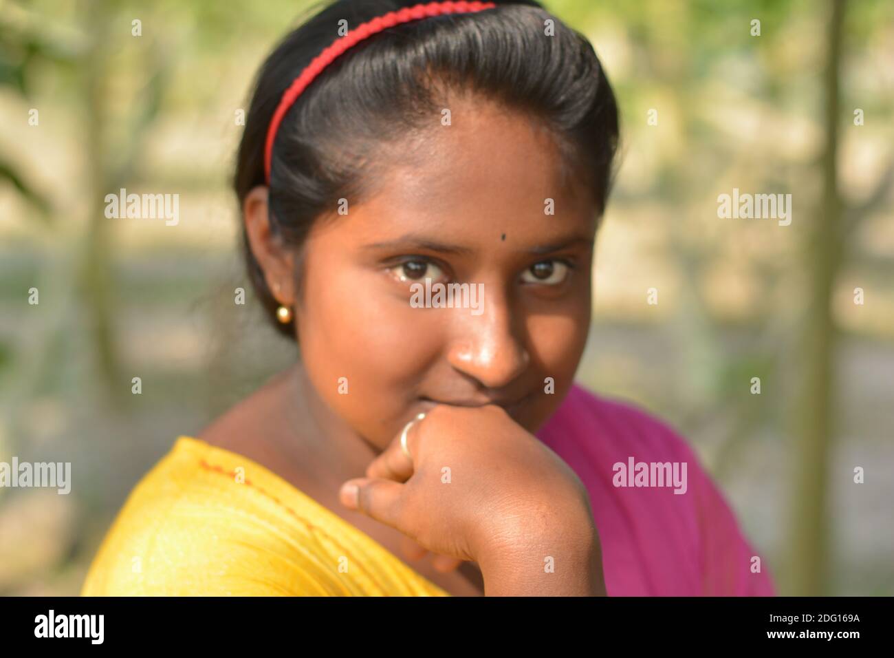 Close up of an Indian Bengali teenage girl wearing yellow color salwar
