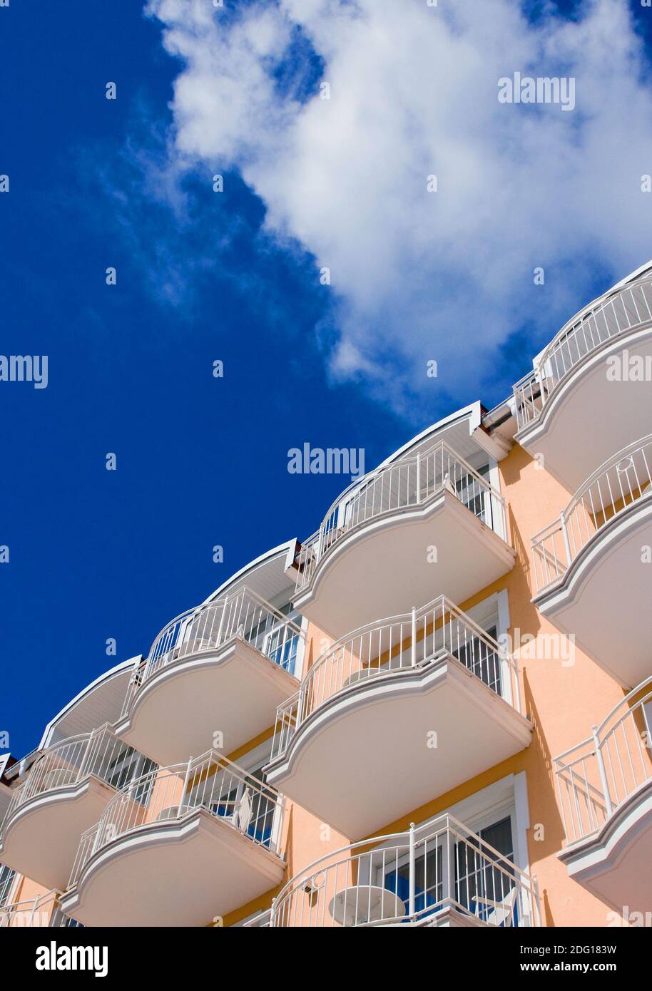 Orange Hotel in front of a blue sky Stock Photo